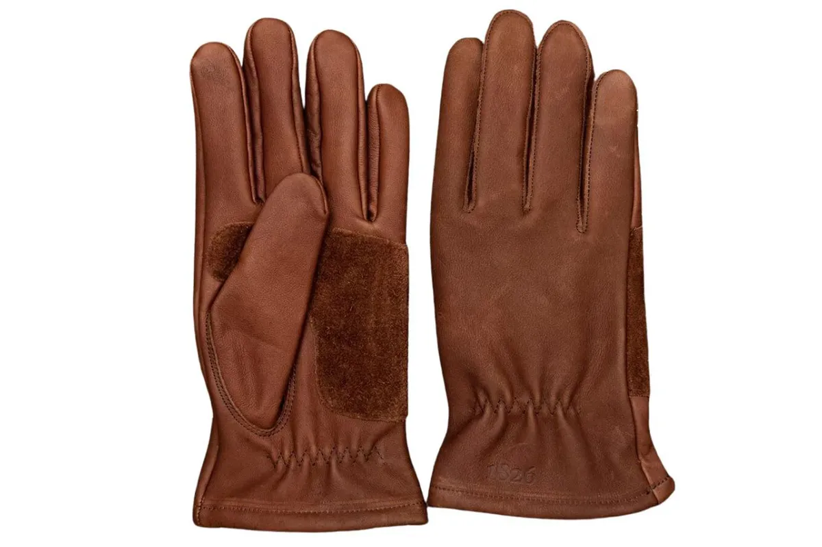 Leather gardening gloves on a white background
