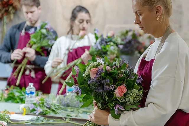 People making hand-tied bouquets