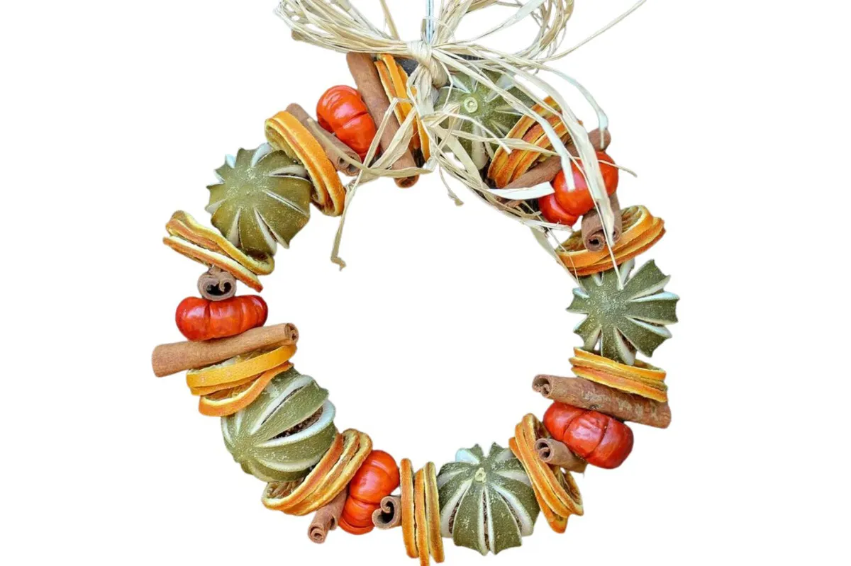 Citrus wreath, scented with orange & cinnamon essential oil on a white background