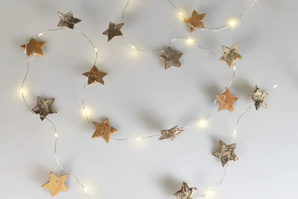 LED Birch Star Garland on a white table