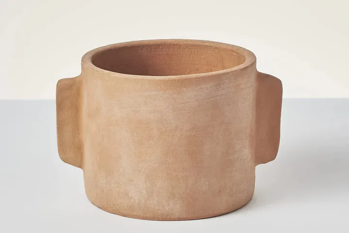 Toast Lugged Terracotta Planter on a grey background