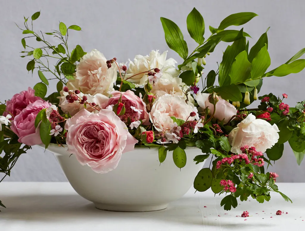 A floral bouquet in a bowl