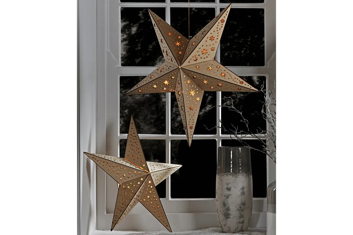 Two Plywood Star Lights in a window
