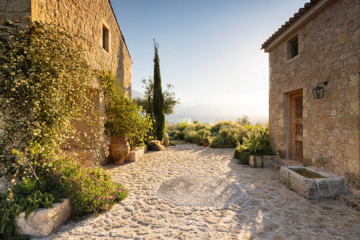 Cobbled entrance courtyard at Ilias Estate,Greece, designed by Tania Compton.