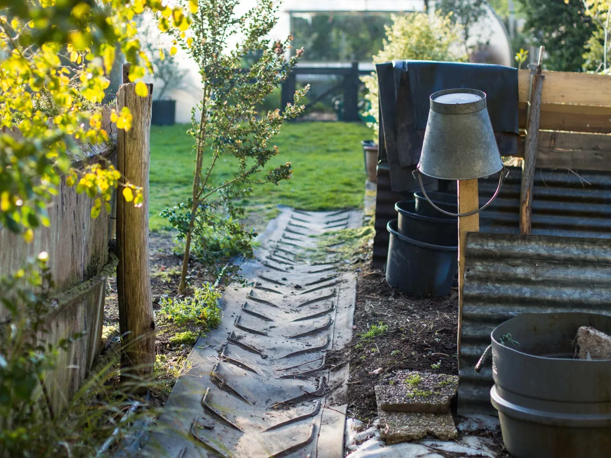 Industrial conveyor belt material used as path in Charlotte Molesworth's garden