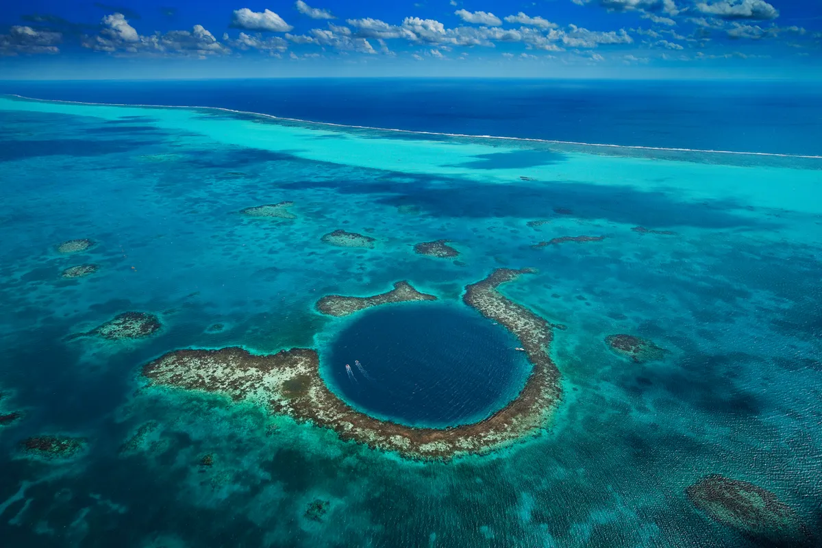 The Great Blue Hole, Lighthouse Reef, Belize © Yann Arthus-Bertrand/Getty Images