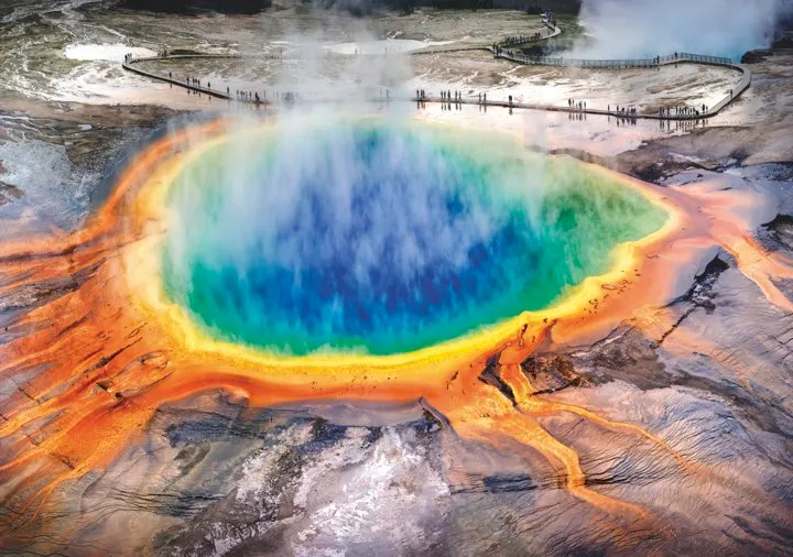Springs and geysers at Yellowstone, like the Grand Prismatic Spring pictured here, hint at the volcanic activity below ground © Getty Images
