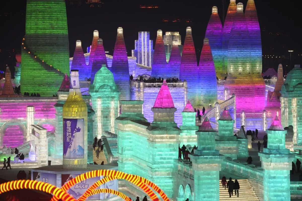 An illuminated ice castle during the Harbin International Ice and Snow Sculpture Festival in Harbin, China © Stringer/Anadolu Agency/Getty Images