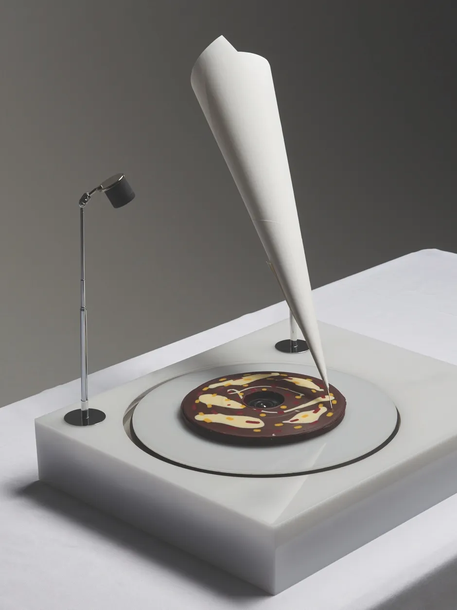 This torte features a thick chocolate coating that plays a tune of your choice when popped in a record player (Erika Marthins ©Photo by Younes Klouche)