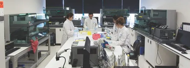 23andMe scientists working in the lab © 23andMe