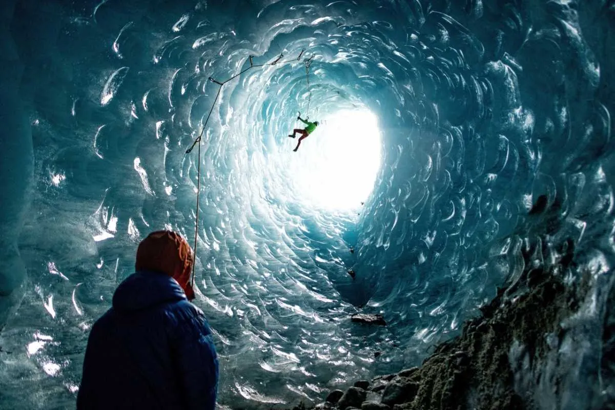 Climbers climb a cylindrical ice cave, France © Mathis Dumas/Solent News/Shutterstock