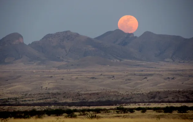 A supermoon sets over these Arizona hills in May 2012 (image credit: Ken Bosma)