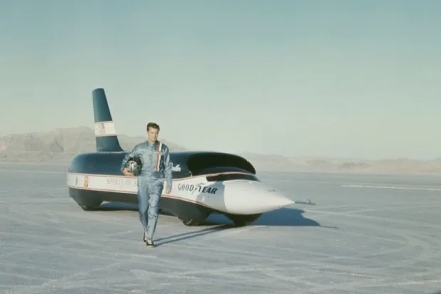 Craig Breedlove stands in front of Spirit of America - Sonic 1 before setting a new world record of 555 mph at Bonneville Salt Flats in Utah, USA on 2 November 1965. (Rolls Press/Popperfoto/Getty Images)