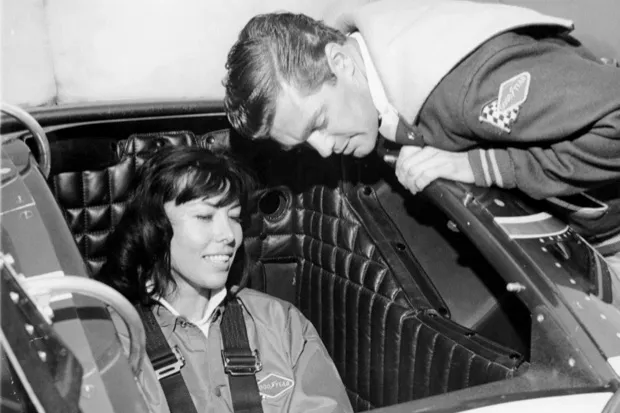 Craig Breedlove explaining the controls of his Spirit of America - Sonic I car to his wife, Lee, 1965 (National Motor Museum/Heritage Images/Getty Images)
