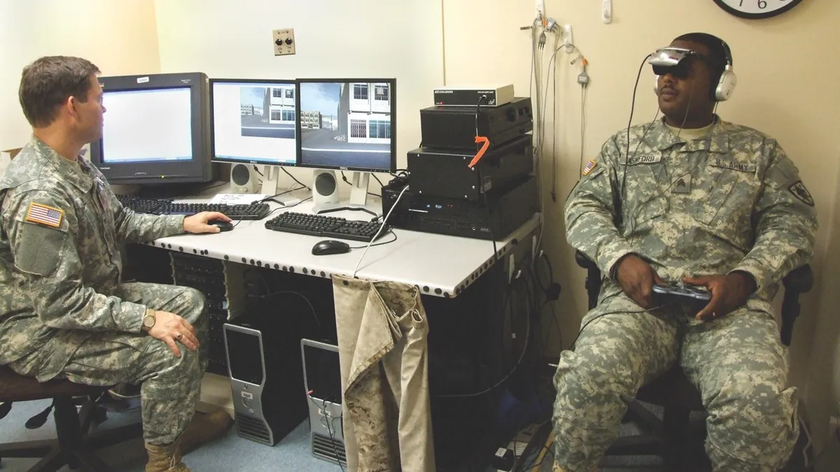 Army Colonel Michael J Roy oversees the ‘Virtual Iraq’ exposure therapy at Walter Reed Army Medical Center, demonstrating a life-like simulator that represents a new form of PTSD treatment (© US Army)