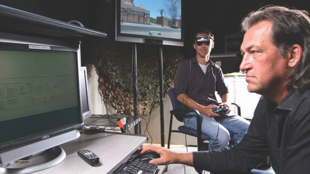 Skip’ Rizzo (right) demonstrates the Bravemind VR system (© Branimir Kvartuc)