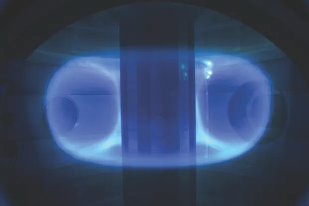 You can peer through the 'port holes' of the ST40 tokamak to see the doughnut-shaped ring of plasma suspended inside by electromagnetism