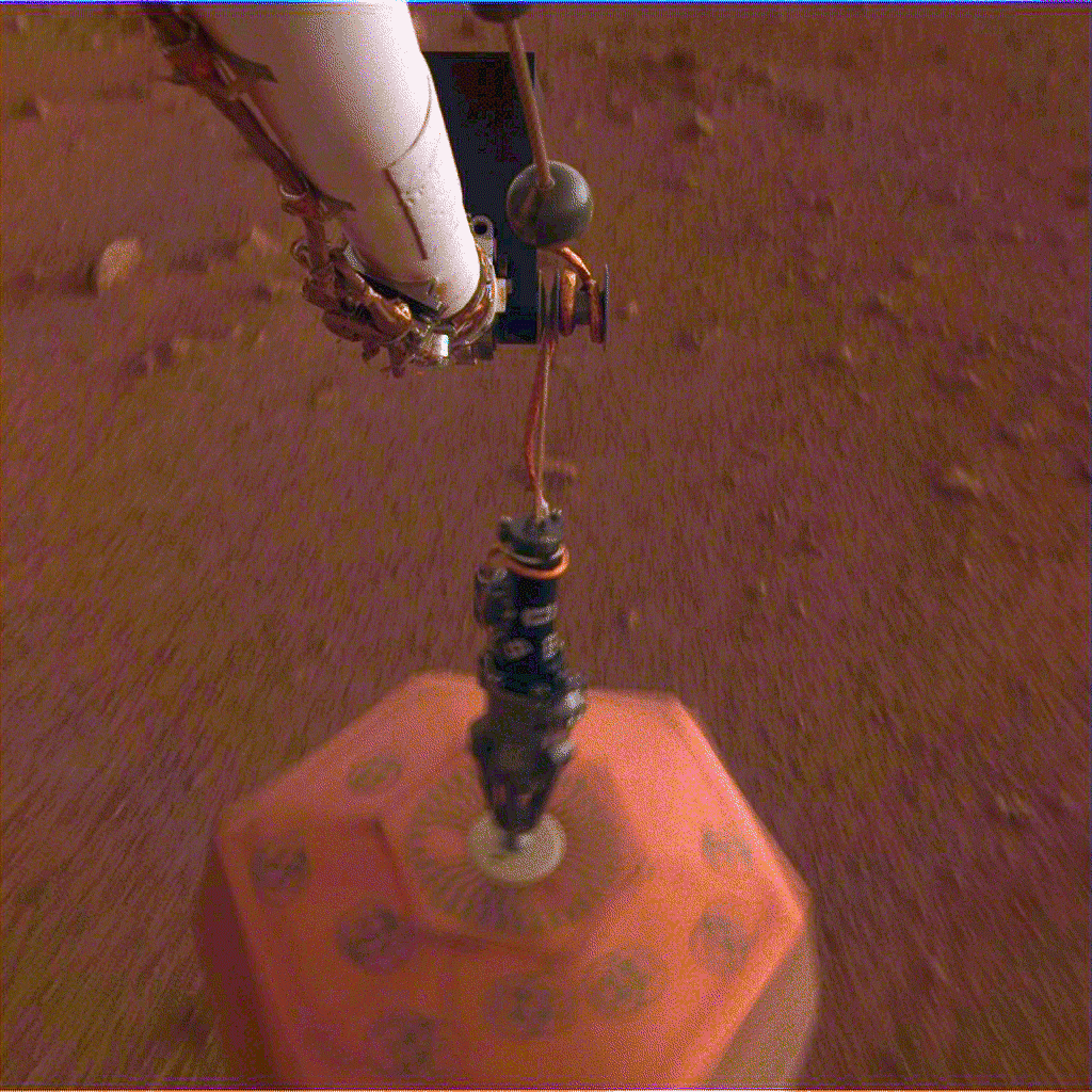 his set of images from the Instrument Deployment Camera shows NASA's InSight lander placing its first instrument onto the surface of Mars, completing a major mission milestone. Image Credit: NASA/JPL-Caltech.