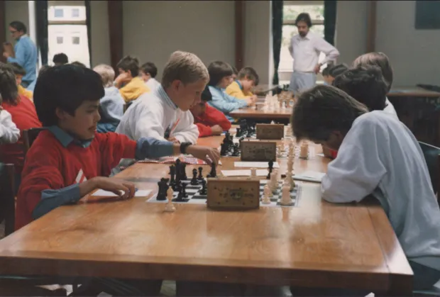 Demis (L) captaining the England under-11's chess team aged 9