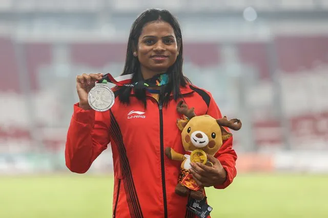 Silver medalist Dutee Chand of India poses for photo during Athletics WomenÕs 200m medal ceremony at GBK Main Stadium on day eleven of the Asian Games on August 29, 2018 in Jakarta, Indonesia. (Photo by Yifan Ding/Getty Images)