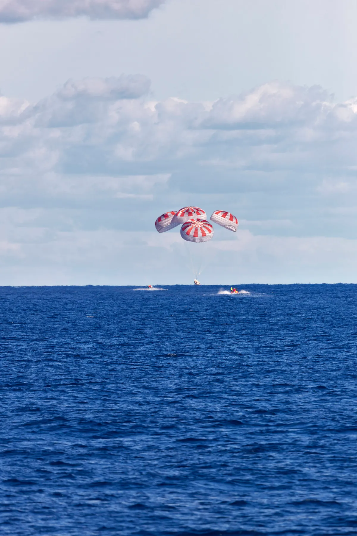 SpaceX's Crew Dragon is guided by four parachutes as it splashes down in the Atlantic Ocean about 200 miles off Florida's east coast on 8 March 2019, after returning from the International Space Station on the Demo-1 mission © NASA