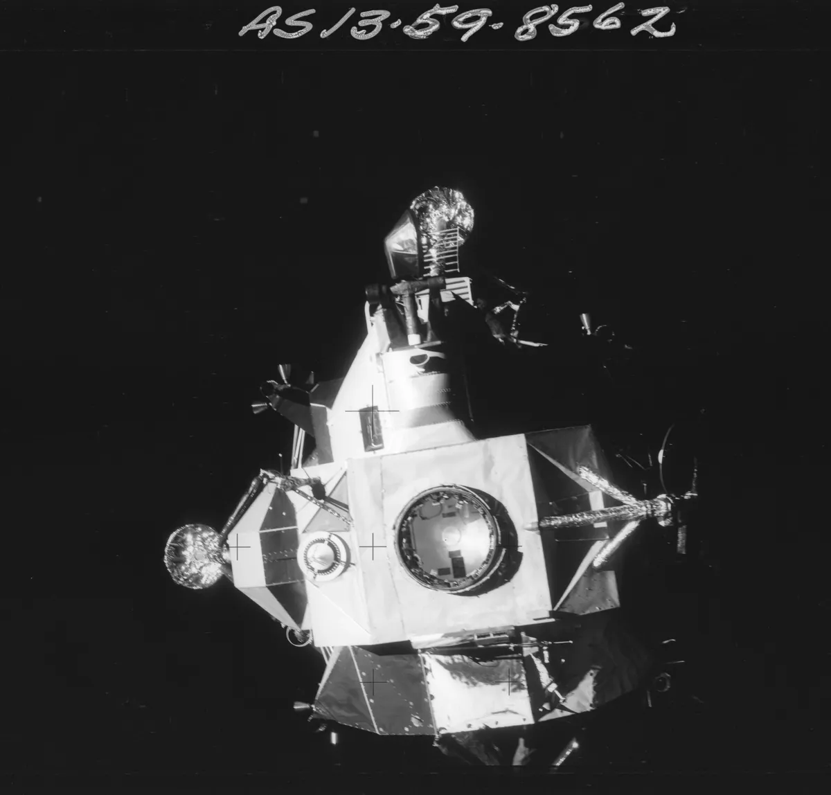 AS13-59-8562 Apollo 13 Hasselblad image from film magazine 59/R - Transfer from LM to CM; LM undocking prior to reentry
