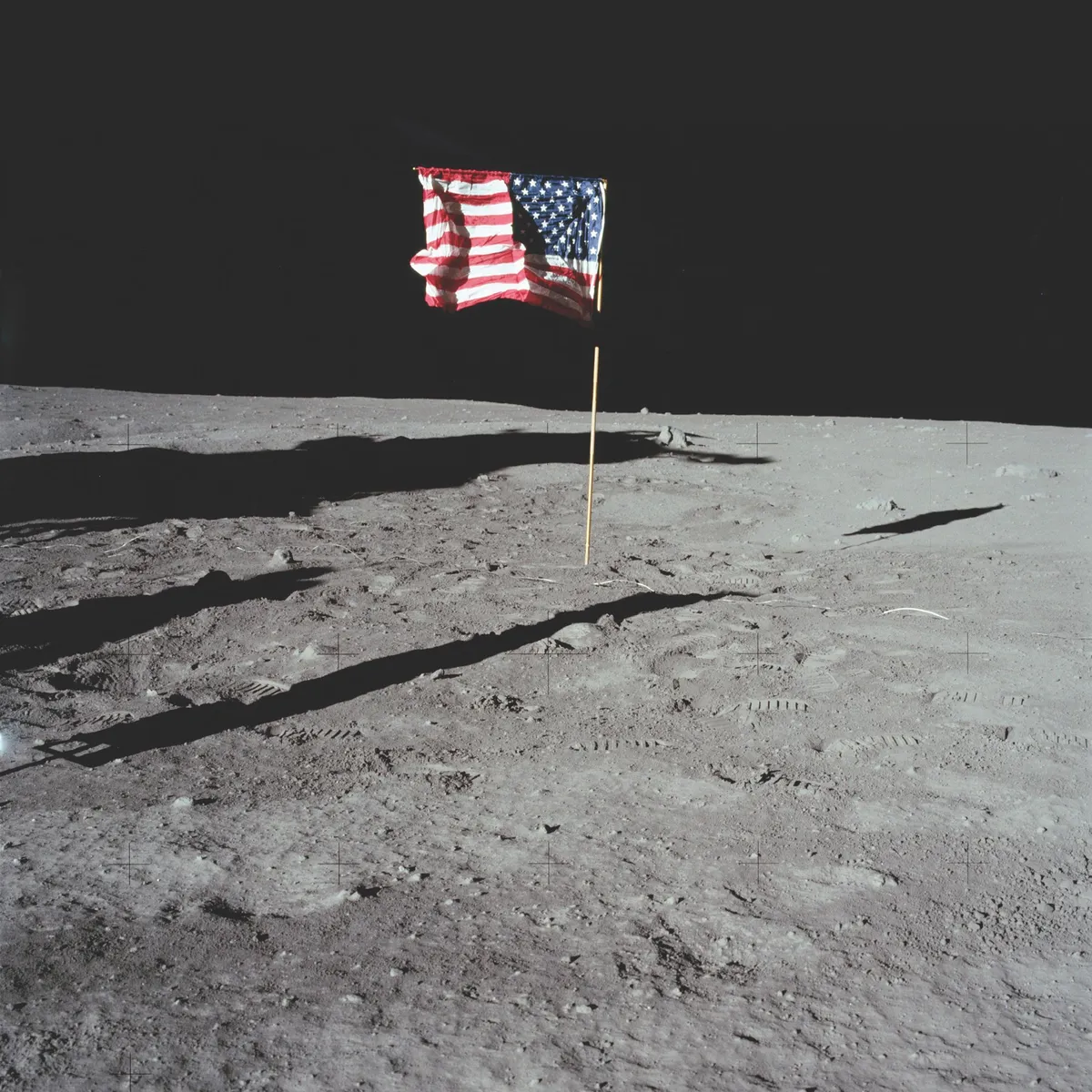Around 90 minutes into his moonwalk, Buzz Aldrin took this photo of the American flag planted in the lunar landscape © NASA/JPL