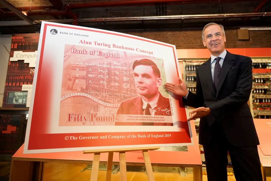 The Governor of the Bank of England, Mark Carney reveals Alan Turing as the new figure to be depicted on the 50 GBP note at the Manchester Science and Industry Museum on July 15, 2019 in Manchester, England. The general public were asked to 'Think Science' and nominate characters from the field of science for the next £50. Turing was selected from over 200,000 nominations for nearly 1000 eligible scientists. (Photo by Christopher Furlong/Getty Images)