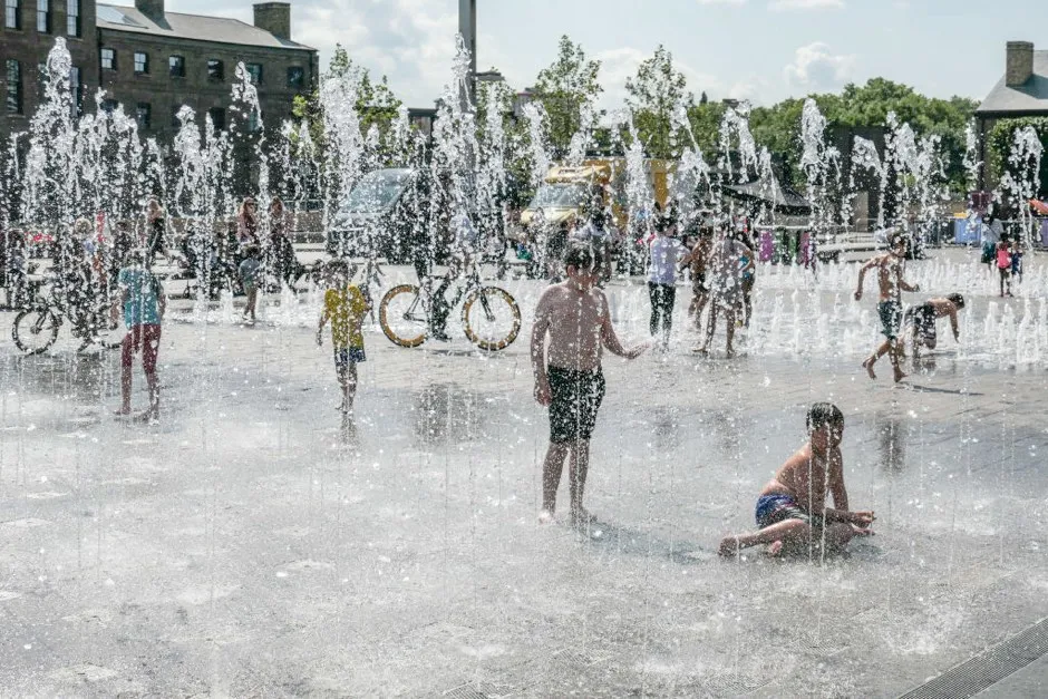 A sunny summer day with high temperatures during a heatwave in London, UK, on August 1, 2019. People including adults and children playing with the water in a dancing fountain at Granary Square, Kings Cross. In July 2019 London city and other cities in Europe had the highest ever measured temperature and the hottest day, a historical record high showing climate and weather change. (Photo by Nicolas Economou/NurPhoto via Getty Images)