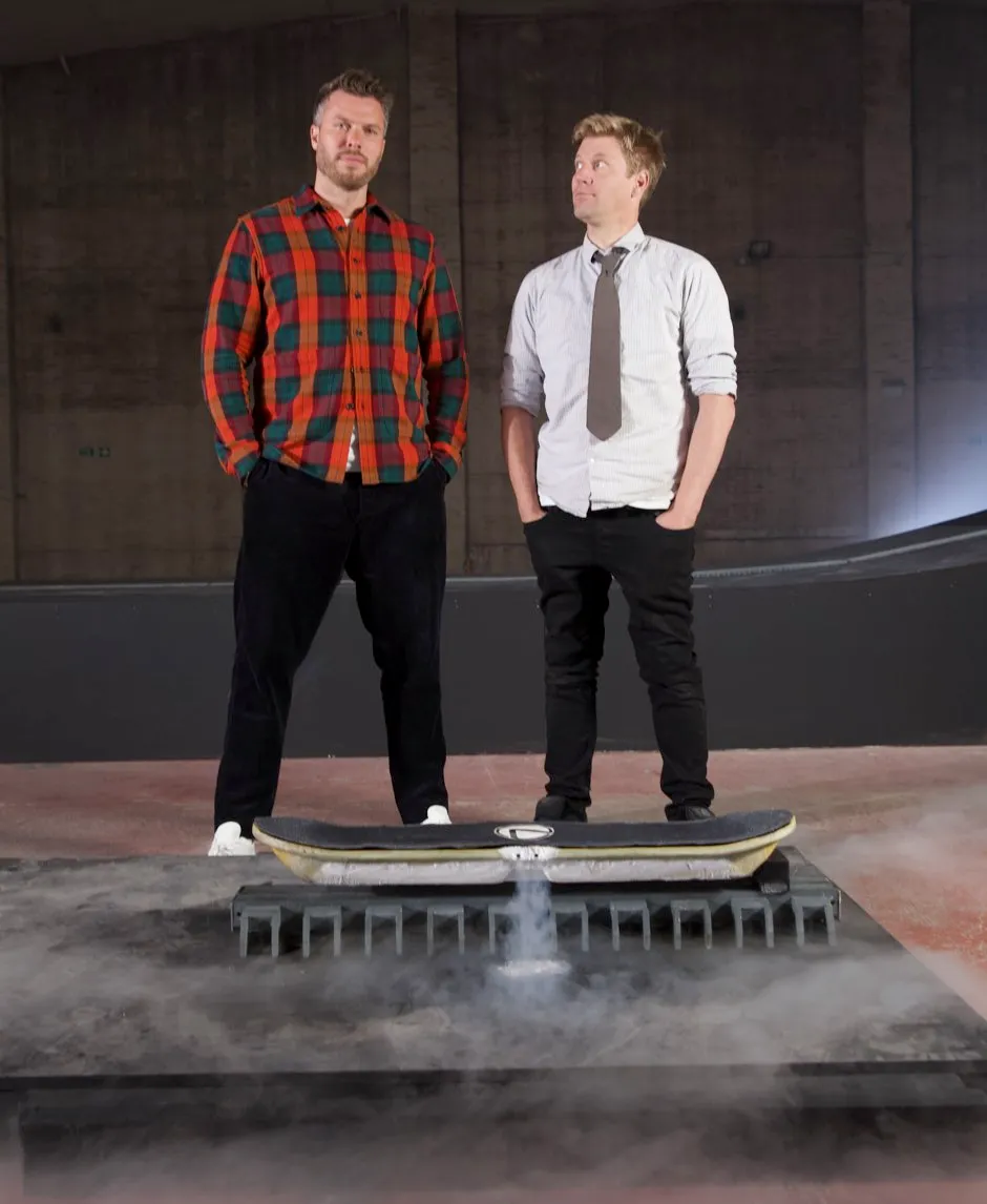 Rick Edwards (L) and Colin Furze (R) in front of their quantum levitating skateboard