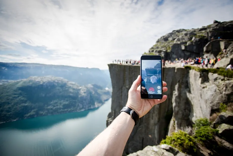 Person hiking on the trail at Preikestolen playing Pokemon GO © Getty Images