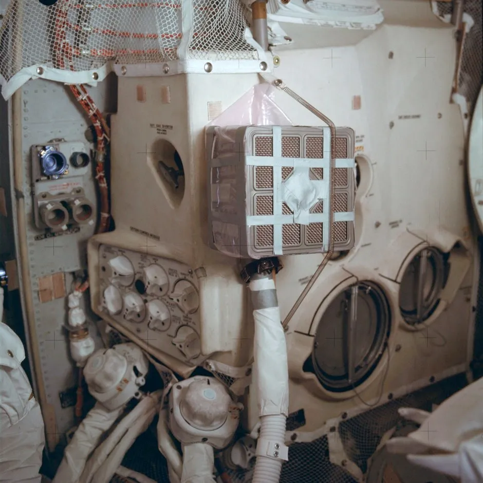 The interior of the Apollo 13 lunar module with the “mail box”, an ad hoc device which the crew assembled while in space to remove carbon dioxide from the air © NASA/AP