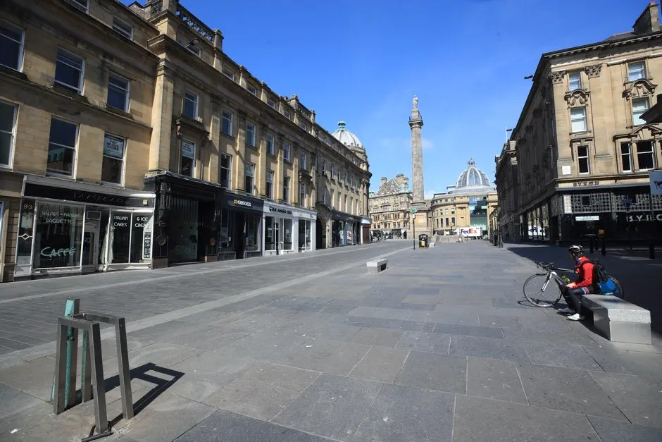 Grey’s monument stands at the top of an empty street in Newcastle upon Tyne as shops and business remain closed during lockdown © Owen Humphreys/PA