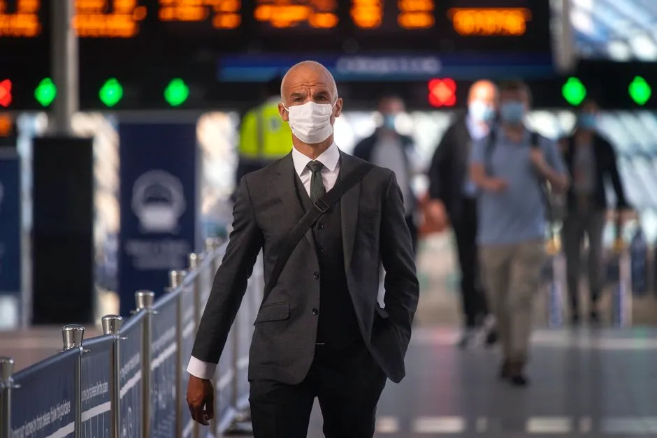 Passengers wearing face masks at Waterloo station in London © Victoria Jones/PA
