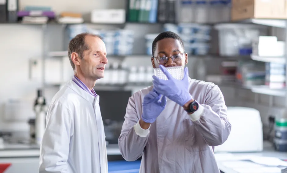 Professor Robin Shattock with research technician Leon Mcfarlane in the lab developing a COVID-19 vaccine © Thomas Angus, Imperial College London