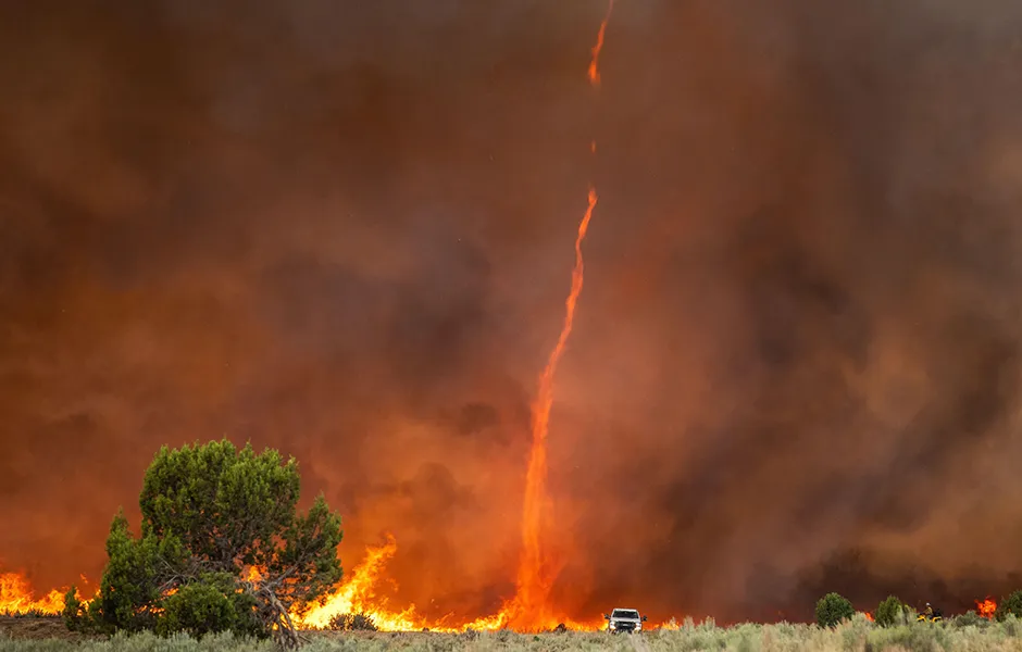 A fire devil or fire tornado rises out of intense flames at the Pine Gulch Fire on the Western Slope 2nd August 2020 near Grand Junction, Colorado.