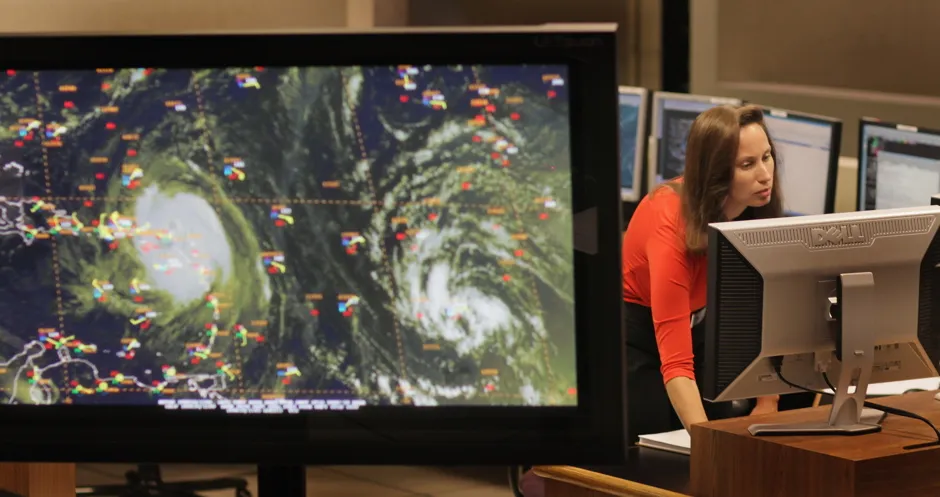 Meteorologist Jessica Schauer tracks a hurricane at the US National Hurricane Center in Miami