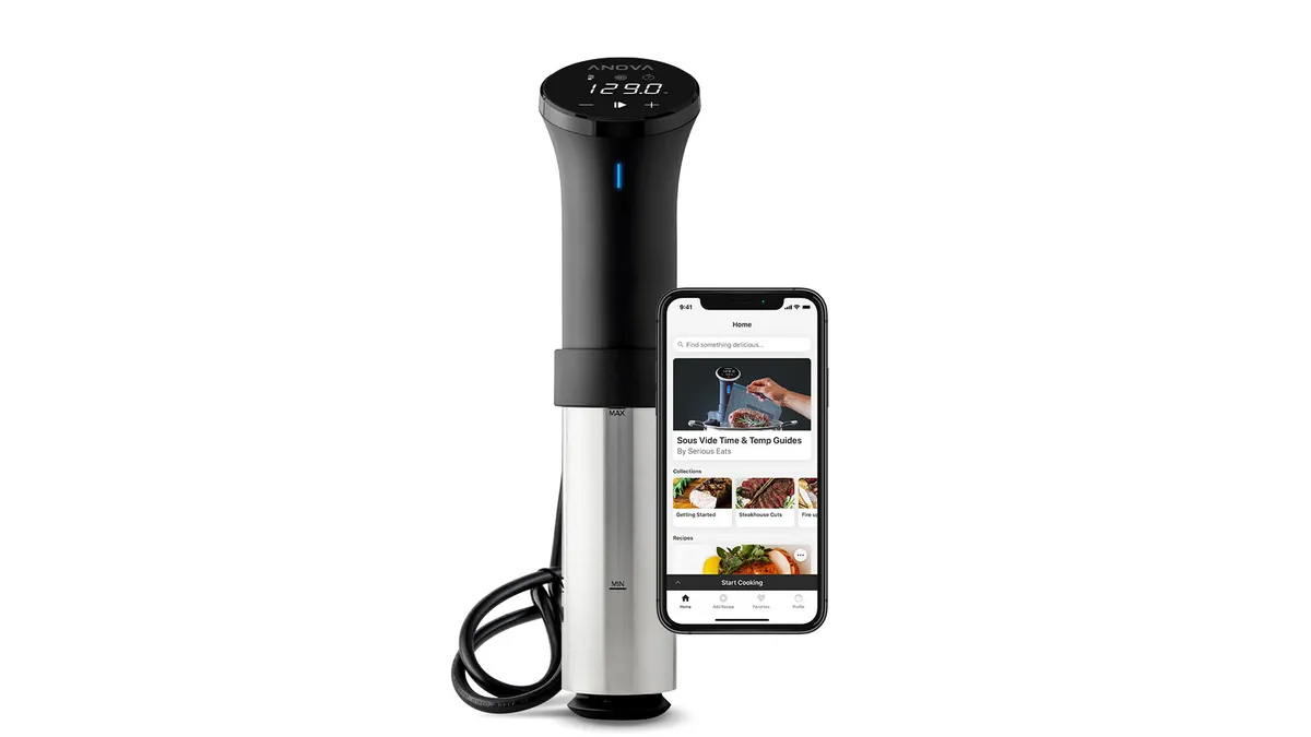 A sous-vide wand and a phone on a white background.