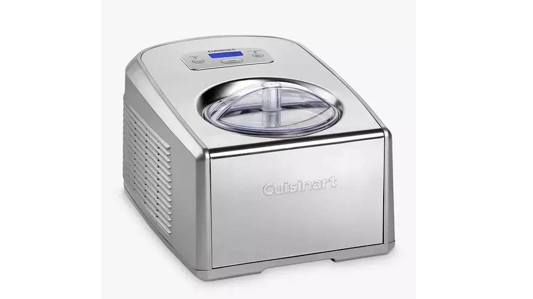 A silver ice cream maker on a white background.