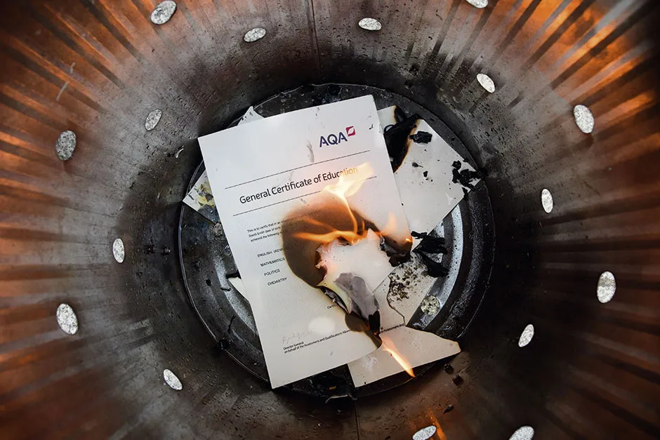 An A level results certificate being burned © Shutterstock