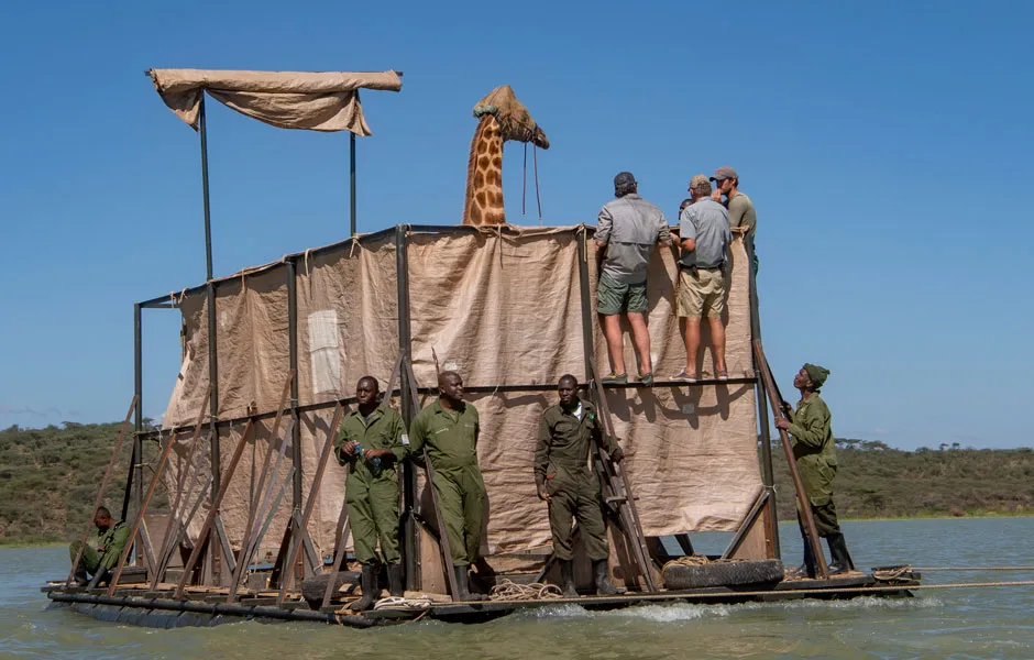 Asiwa, blindfolded, on the raft with seven people © Save Giraffes Now