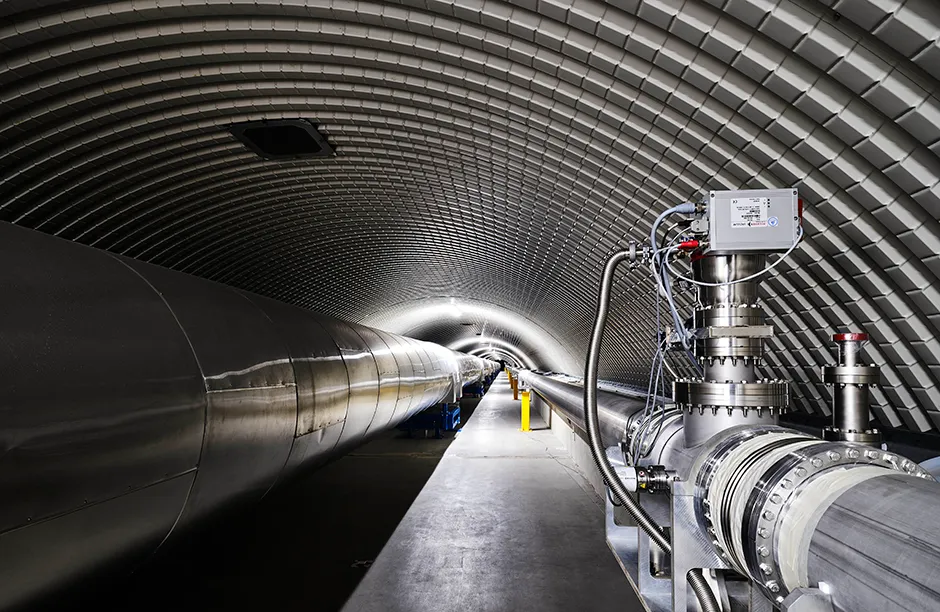North arm of the Advanced VIRGO  Gravitational Wave Observatory. VIRGO  comprises two arms, each 3km long, set at right angles to eachother. Laser beams pass up and down these tubes before being recombined to make an interference pattern. A change in this pattern can be caused by a passing gravitational wave.