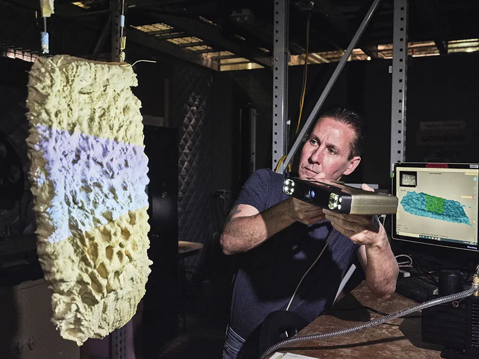 A worker scans a sample of a spongy material called mycelium © Luca Locatelli/Institute