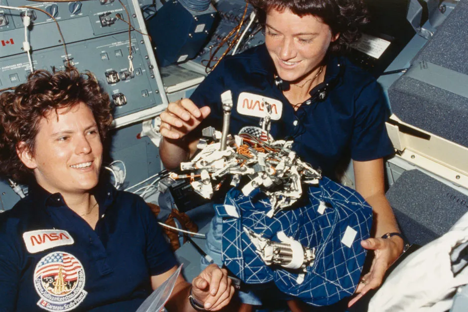 NASA astronauts Kathryn D. Sullivan (left) and Sally Ride (1951 - 2012) in the interior of the Challenger space shuttle during the STS-41-G mission, October 1984 © Getty