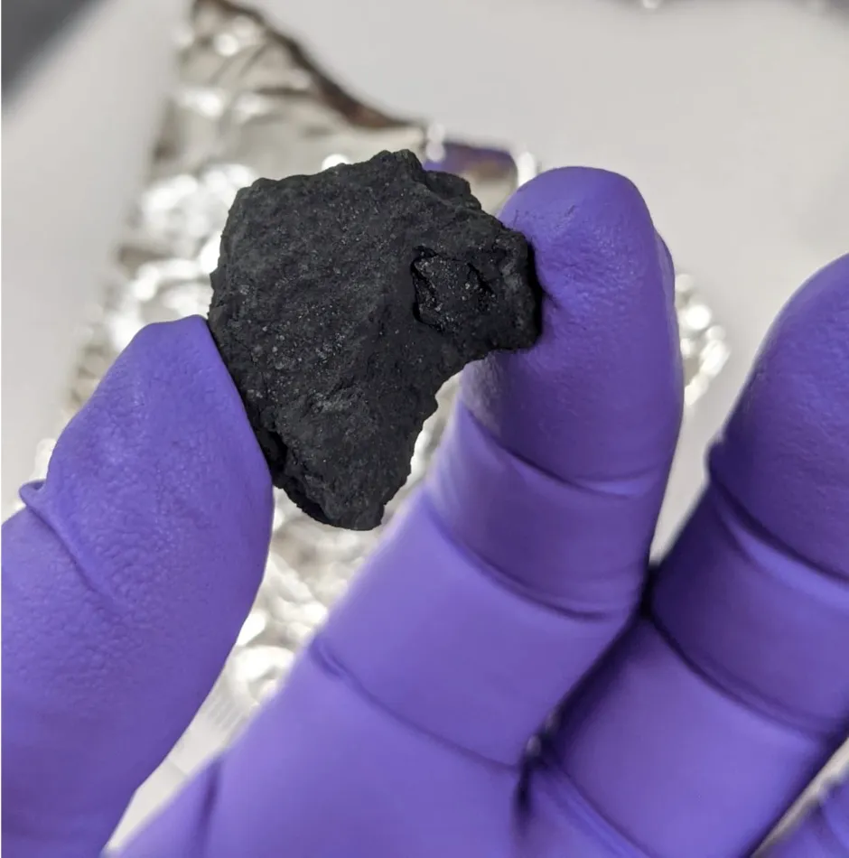 Fragment from a meteorite, likely to be known as the Winchcombe meteorite, which is an extremely rare type called a carbonaceous chondrite © Trustees of the Natural History Museum/PA