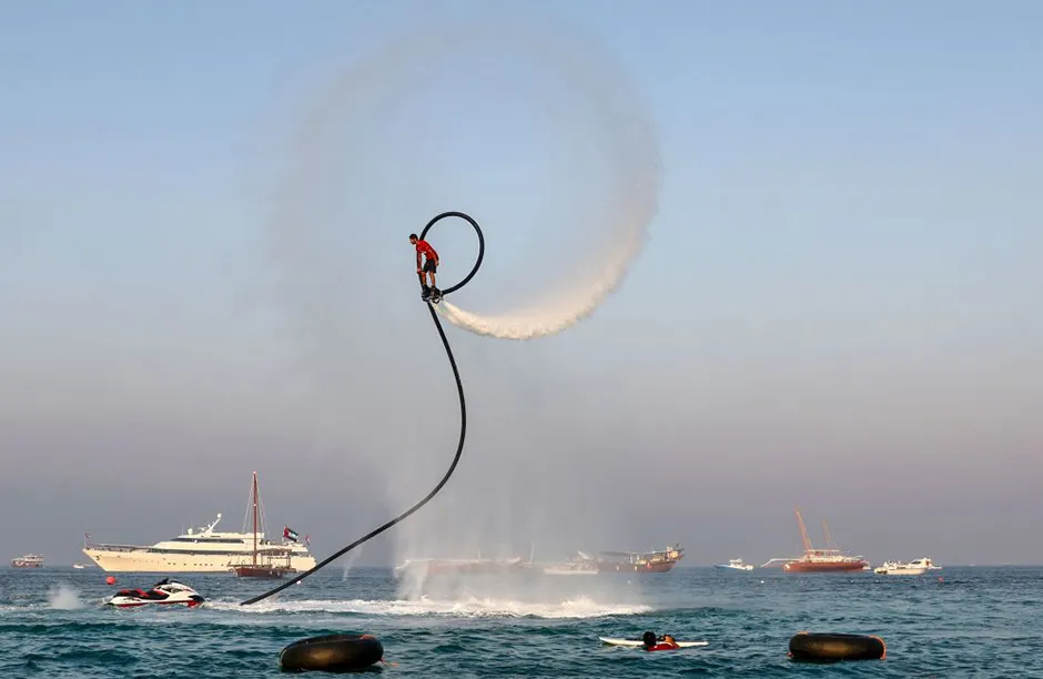 A man performs on a Flyboard in the Gulf Emirate of Sharja on June 3, 2021. (Photo by Karim SAHIB / AFP) (Photo by KARIM SAHIB/AFP via Getty Images)