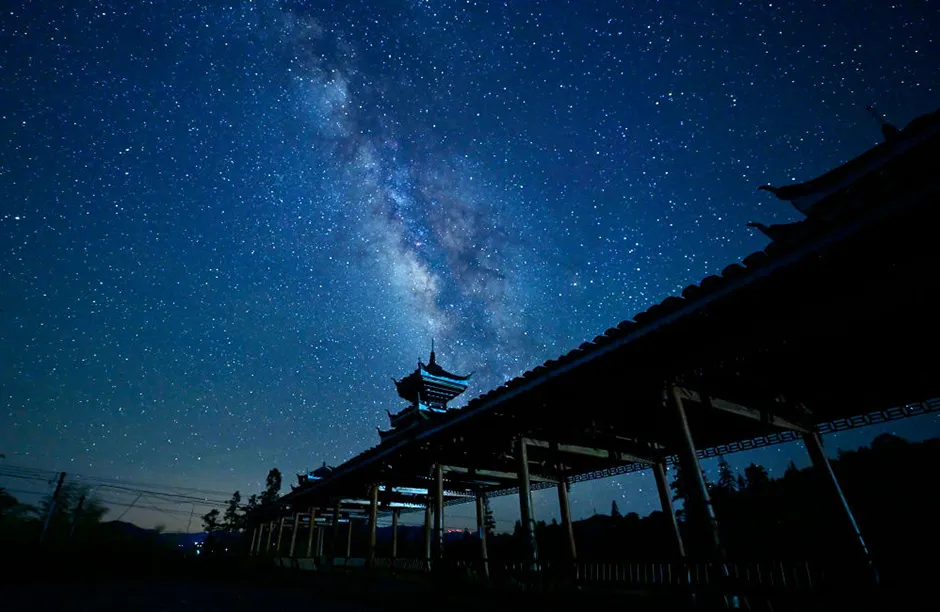 CONGJIANG, CHINA - JUNE 6, 2021 - The Milky Way is seen in the sky over Datang Miao Village in Bingmei Town, Congjiang County, southwest China's Guizhou Province, June 6, 2021. (Photo credit should read Costfoto/Barcroft Media via Getty Images)