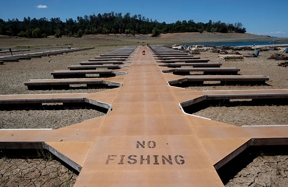 Mandatory Credit: Photo by Josh Edelson/AP/Shutterstock (12008958d) Empty boat docks sit on dry land at the Browns Ravine Cove area of drought-stricken Folsom Lake, currently at 37% of its normal capacity, in Folsom, Calif., . California Gov. Gavin Newsom declared a drought emergency for most of the state California Drought Reservoirs, Folsom, United States - 22 May 2021