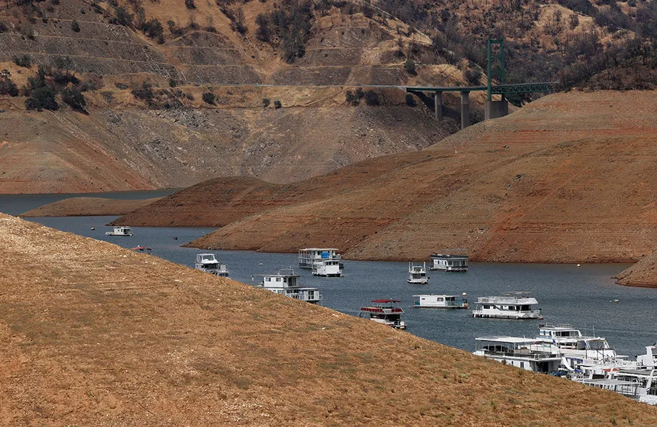 Mandatory Credit: Photo by JOHN G MABANGLO/EPA-EFE/Shutterstock (12079872a) Houseboats float below normal levels at the Bidwell Canyon Marina on Lake Oroville in Oroville, California, USA, 14 June 2021. Many owners are leaving their boats in the water instead of taking them to dry dock as water levels are at a record low due to chronic drought in the west of the United States. Numerous counties of California are now under a drought state of emergency and the California Governor Gavin Newsom is asking Californians to conserve water. Lake Oroville at low levels in California drought, USA - 14 Jun 2021
