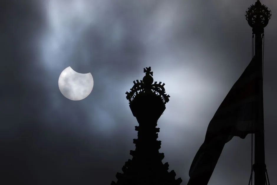 A partial solar eclipse is seen over the Houses of Parliament on June 10, 2021 in London, England. © Getty